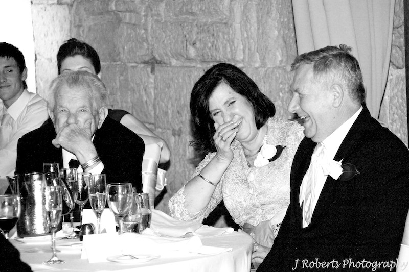 Bride parents laughing during speeches - wedding photography sydney
